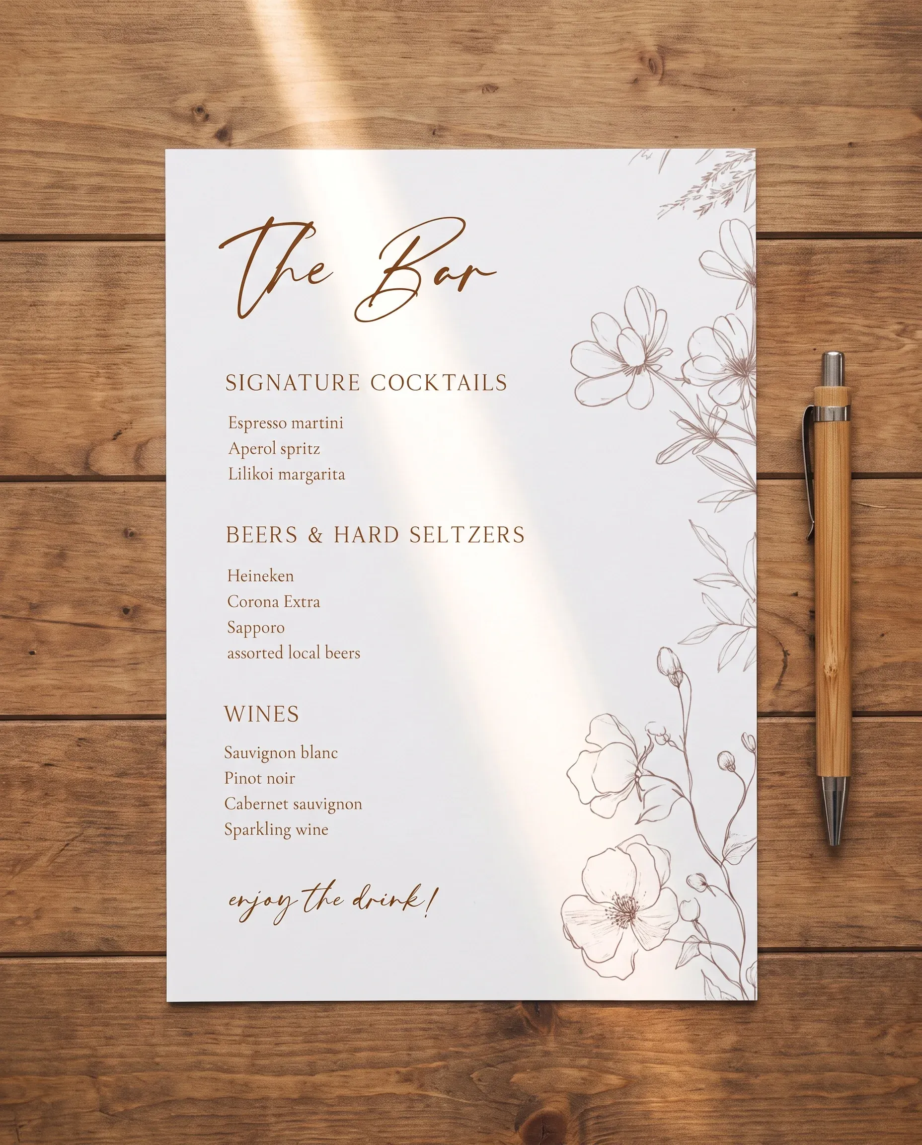 Arrow Bloom — single page bar menu shown flat under soft natural light from a slight overhead angle, wedding bar menu