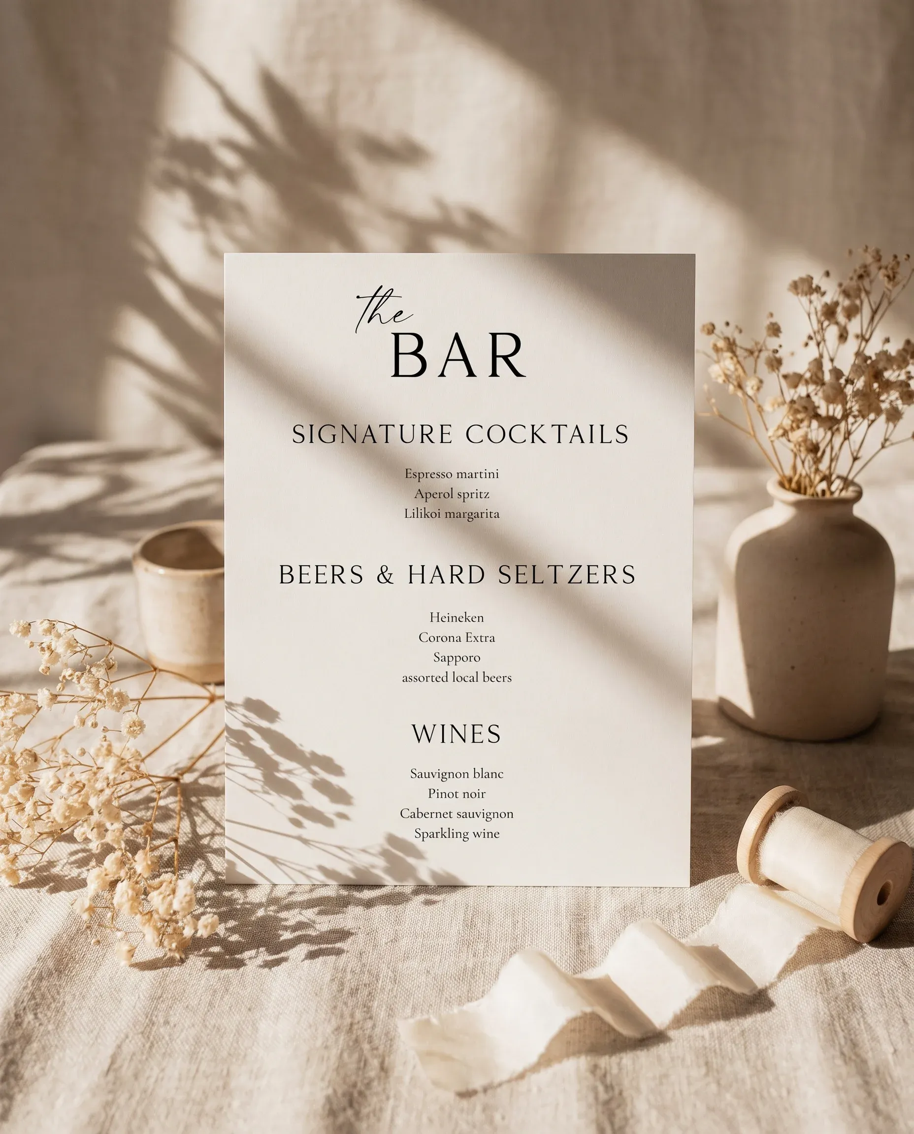Sunlit — bar menu displayed upright in a styled setting under soft natural light at a slight overhead angle, wedding bar sign.