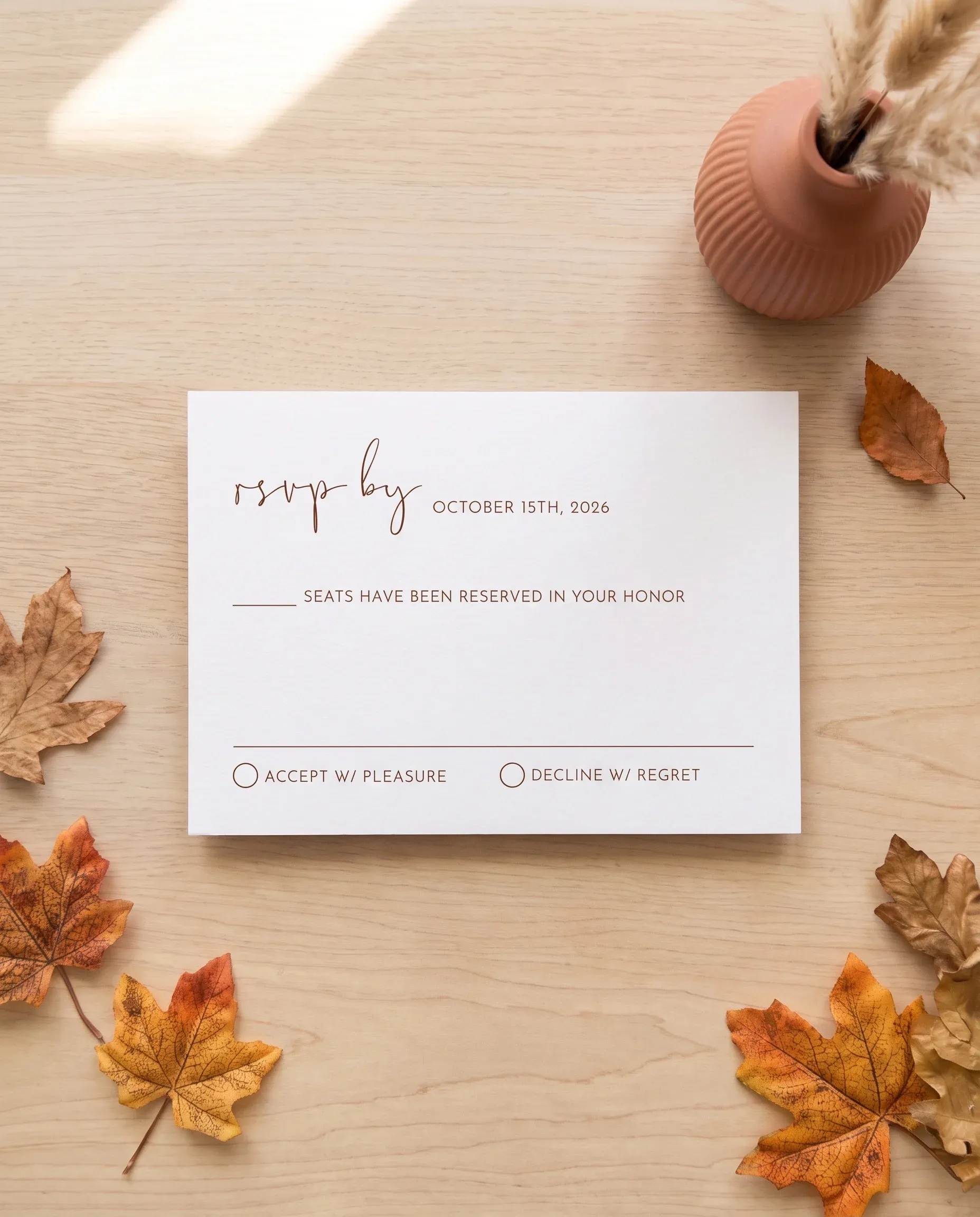 Stevens wedding invitation suite — RSVP card shown in a flat lay on premium editorial paper under soft natural light, slight overhead angle, wedding RSVP cards.