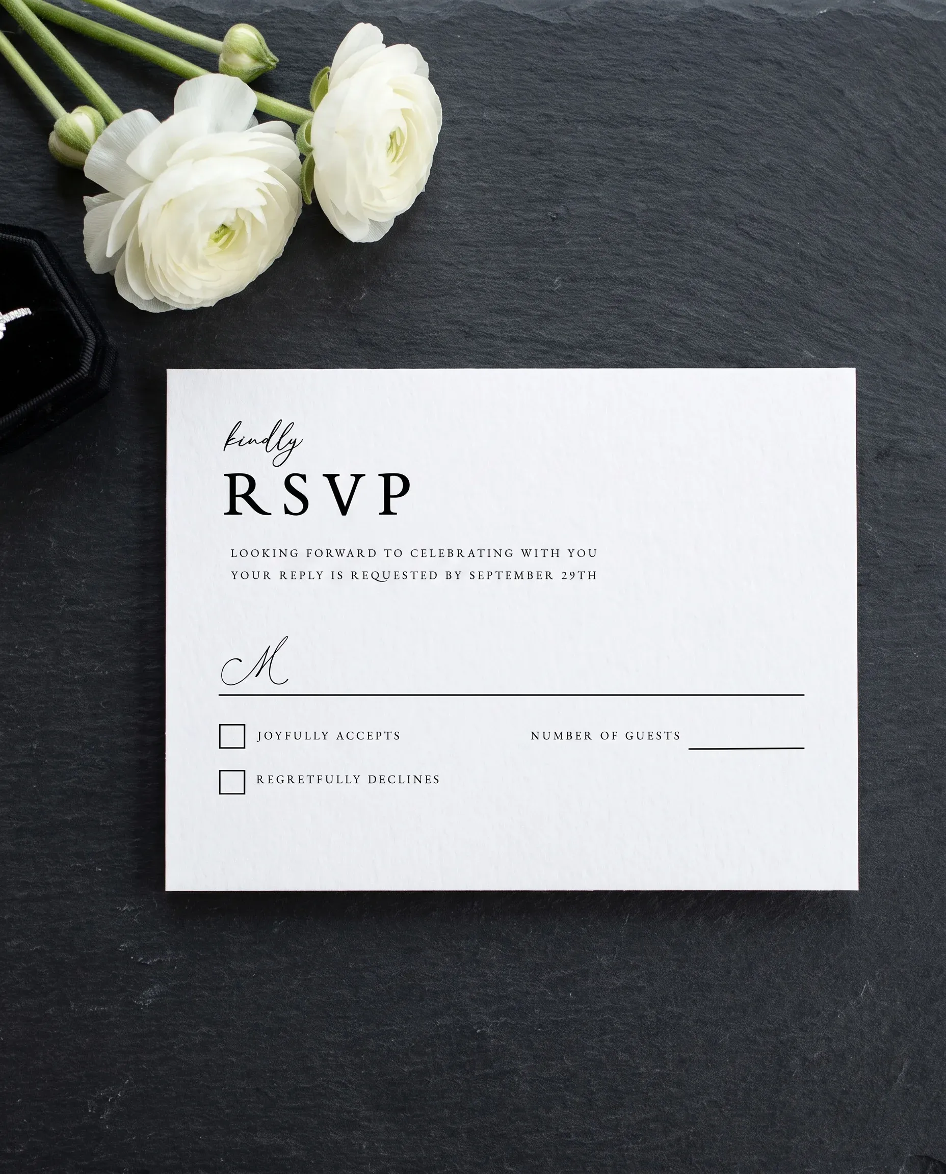 Monochrome Veil wedding invitation suite — RSVP card shown in a flat lay on premium editorial paper, slight overhead angle, wedding RSVP cards.