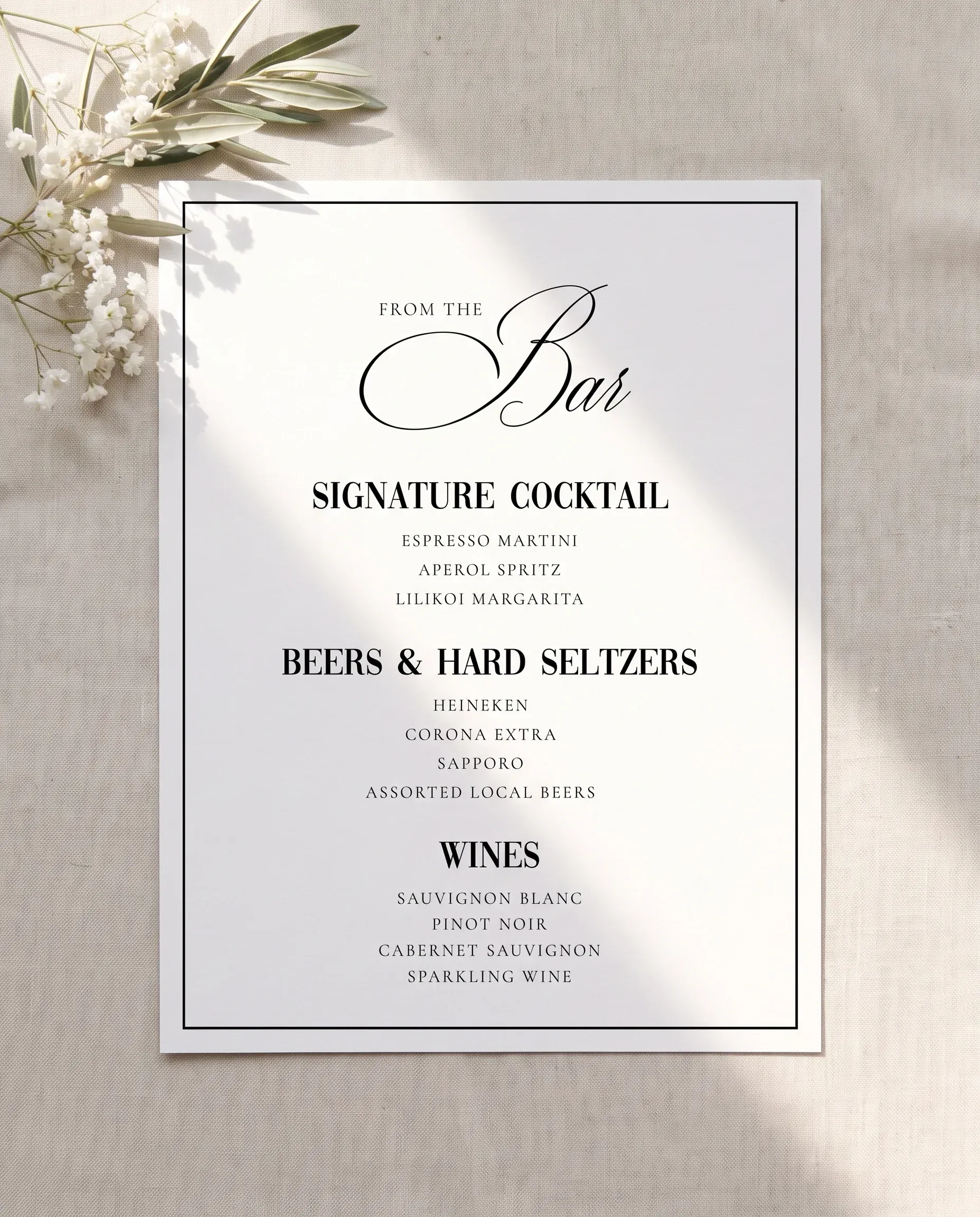 Crestline — flat lay of the bar menu on premium editorial paper under soft natural light at a slight overhead angle, wedding bar menu.