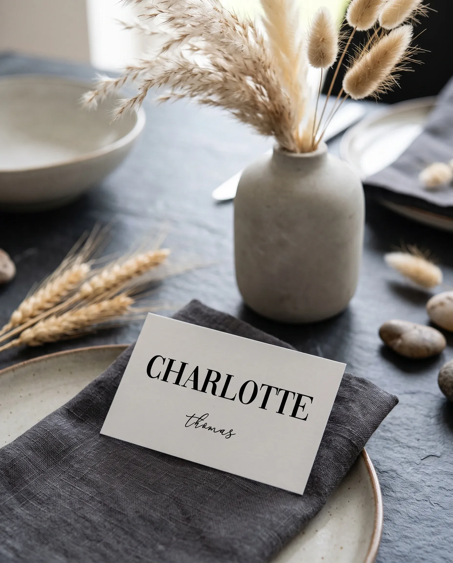 Barline wedding place cards — a single card viewed at a slight overhead angle on a table setting, wedding name cards.
