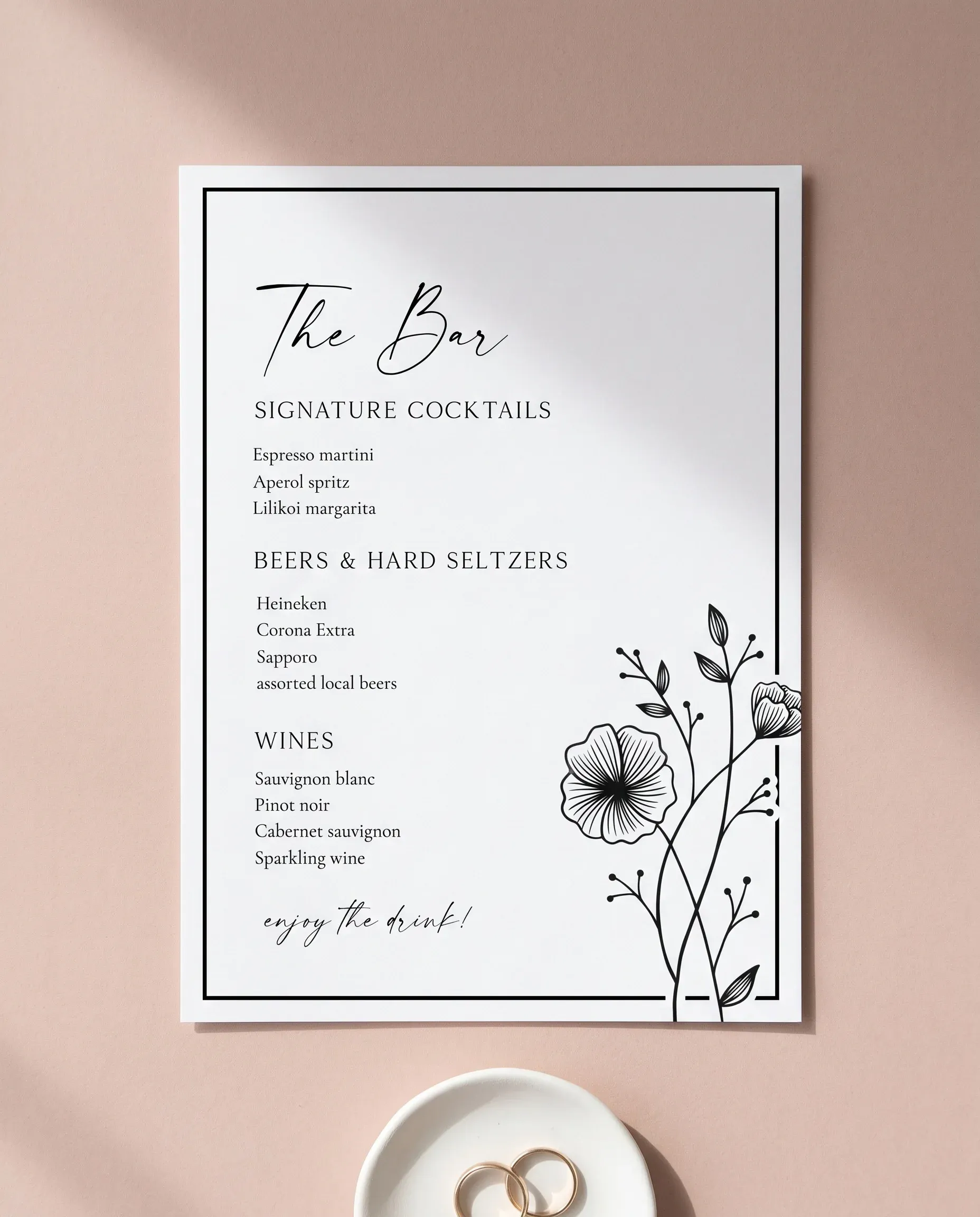 Hush Bloom — flat lay of the bar menu on premium editorial paper under soft natural light, wedding bar menu.
