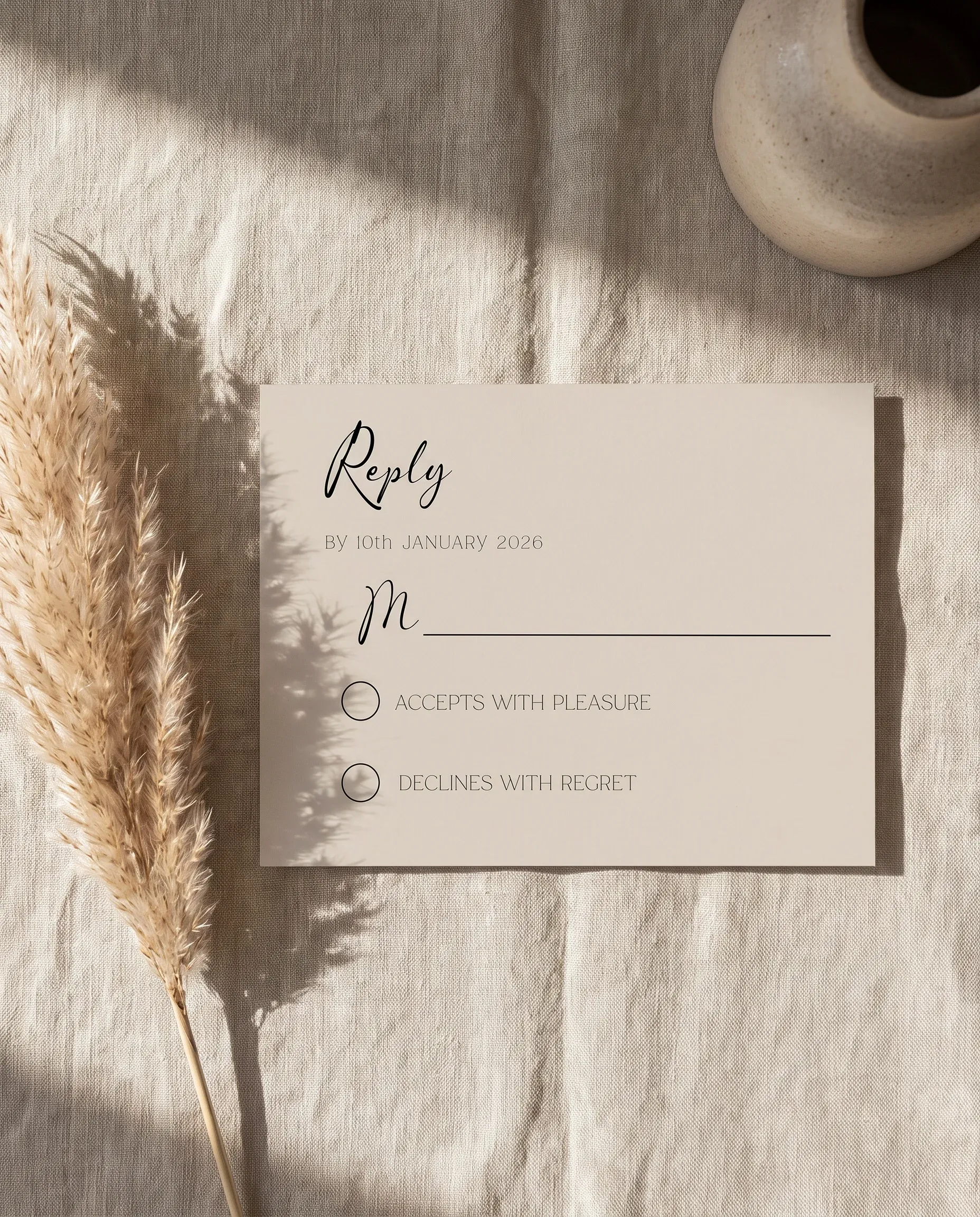 Tassel Arc wedding invitation suite — RSVP card shown in a flat lay on premium editorial paper under soft natural light, wedding RSVP cards.