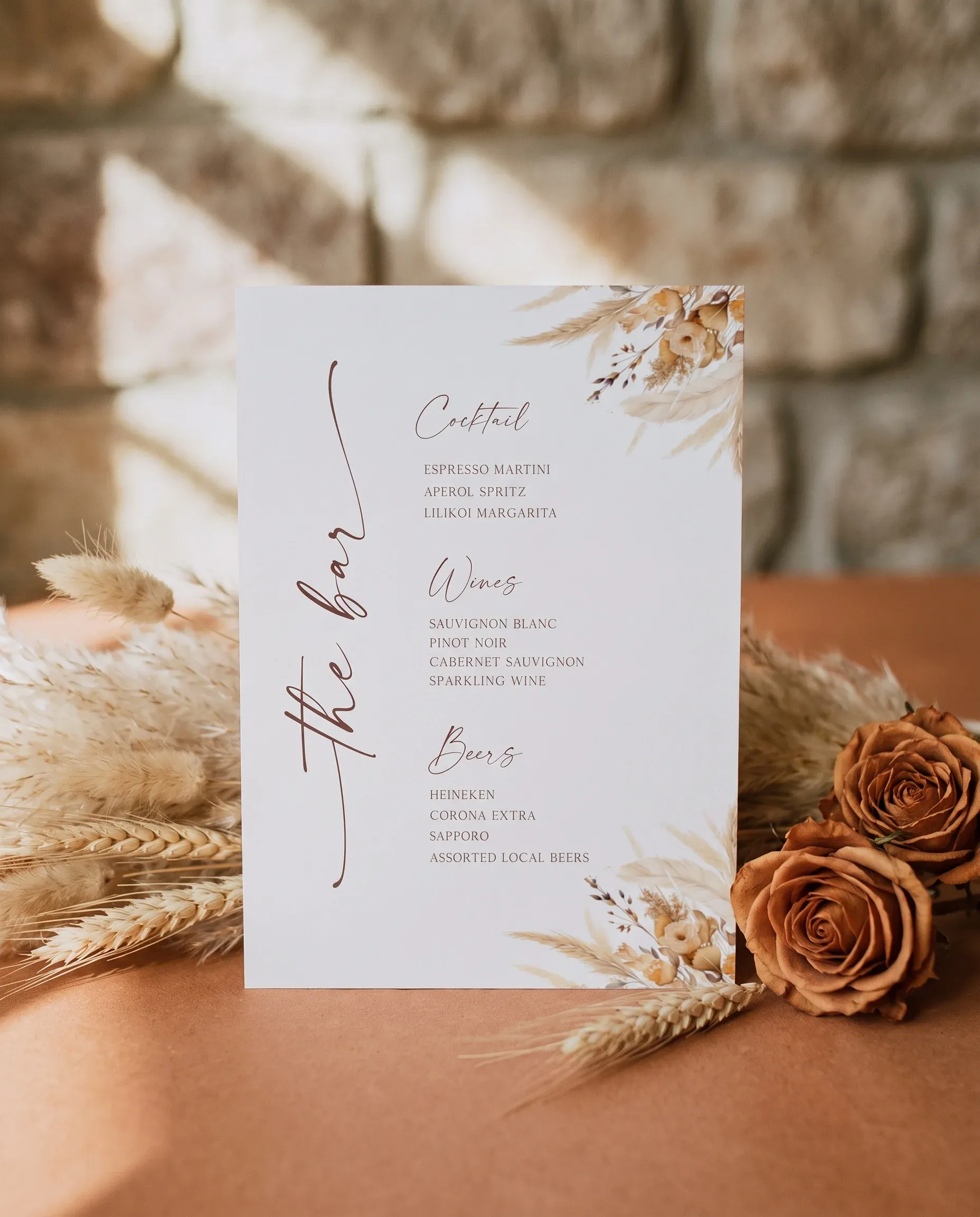 Harvest Script — bar menu displayed upright in a styled setting under soft natural light with a slight overhead angle, wedding bar sign.